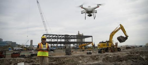 Contractors at the site of the South Harbor campus in Milwaukee utilizing components of Komatsu’s Smart Construction technologies.