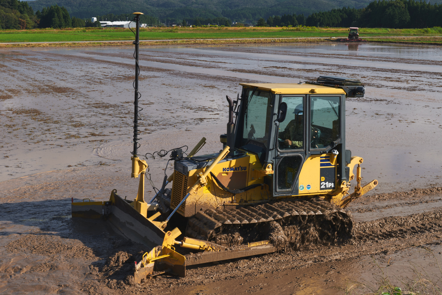 Dozers add precision and efficiency to the job of leveling fields