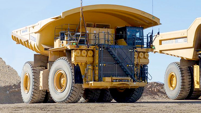 A Komatsu dump truck with a DT Hi-Load dump truck body